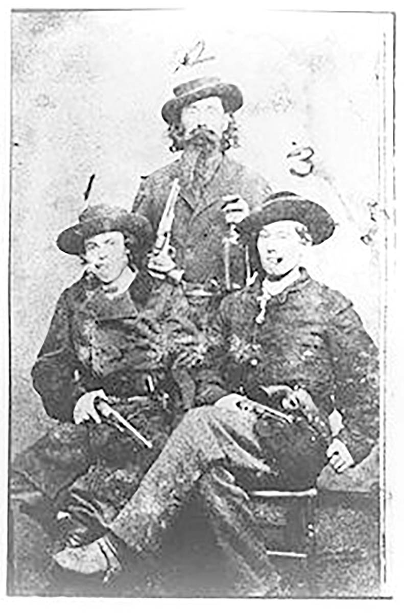 Smilin’ Archie Clements (left), Dave Poole  (center) with an 1860 Army and Bill Hendricks (right). Note the multiple pistols on display.  They had more on their saddles.